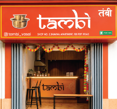 Inside the ambient teak and brass Tambi Cafe